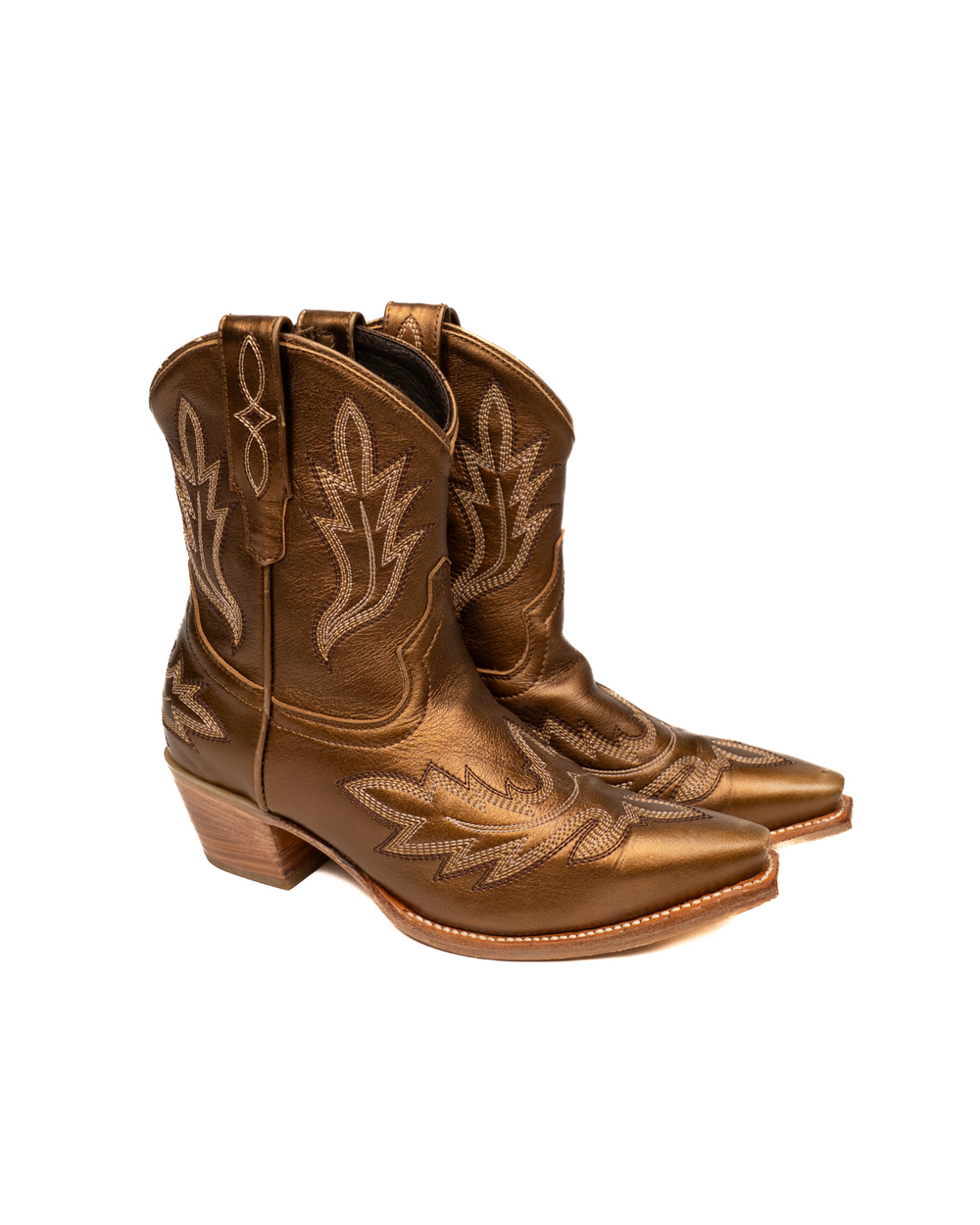 Pair of short brown cowboy boots with intricate stitching